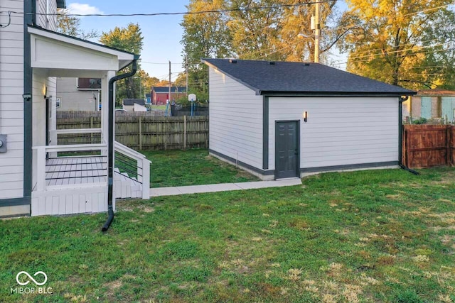 view of outbuilding with a lawn