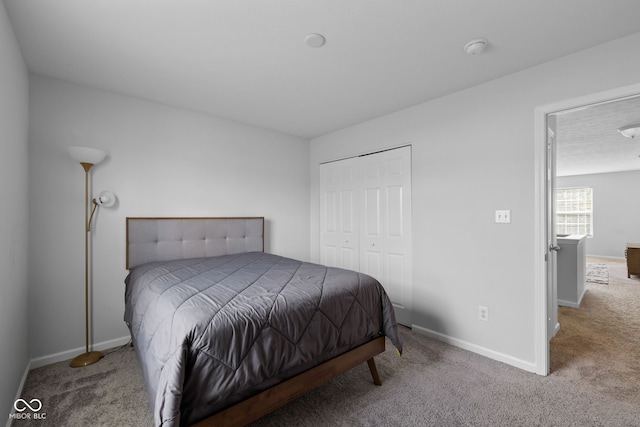 bedroom featuring a closet and carpet flooring