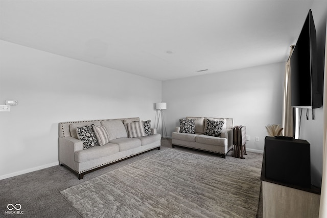 living room with dark colored carpet