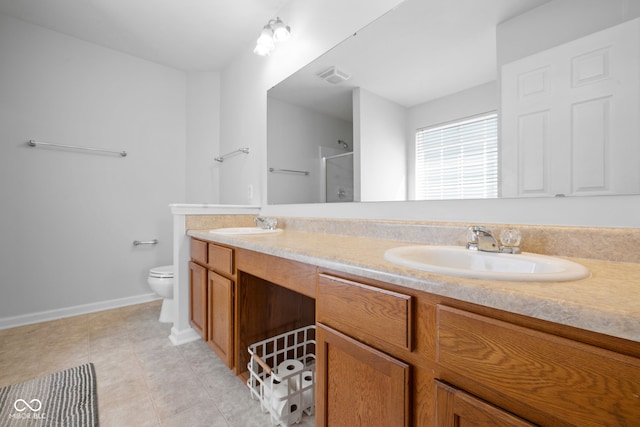 bathroom featuring a shower with door, vanity, toilet, and tile patterned floors