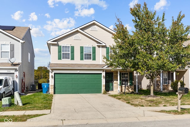 view of front of home with central AC unit and a garage