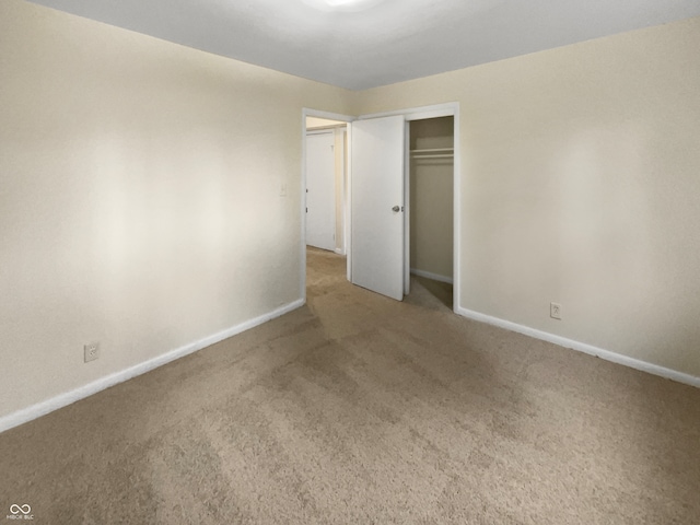 unfurnished bedroom featuring a closet and carpet flooring