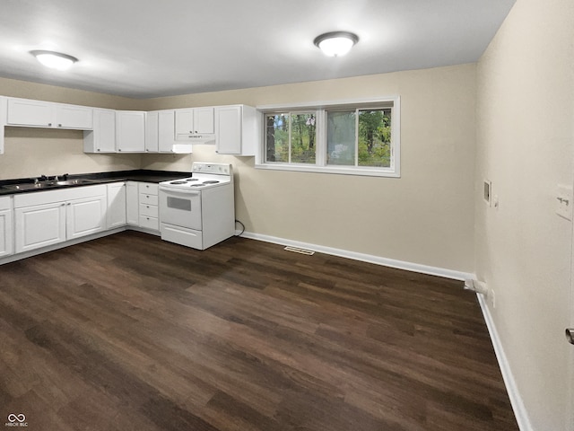 kitchen with white cabinetry, sink, dark hardwood / wood-style floors, and electric range