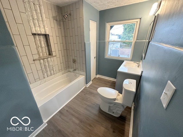 full bathroom with toilet, tiled shower / bath combo, and hardwood / wood-style flooring