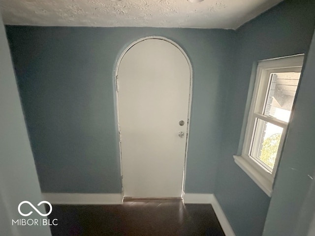 interior space with a textured ceiling