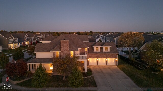 7189 Lockford N, Avon, IN 46123 - view of front of home featuring driveway, a residential view, a garage, and a shingled roof