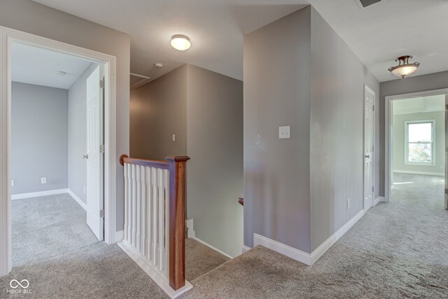7189 Lockford N, Avon, IN 46123 - hall with an upstairs landing, carpet floors, and baseboards