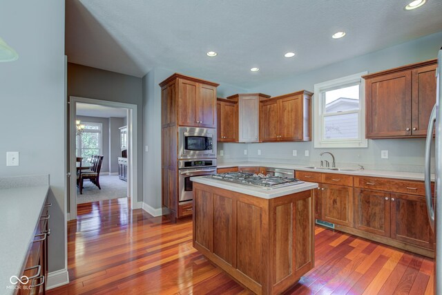 7189 Lockford N, Avon, IN 46123 - kitchen featuring appliances with stainless steel finishes, a sink, hardwood / wood-style flooring, light countertops, and recessed lighting