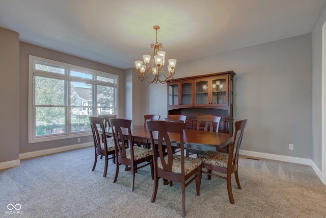 7189 Lockford N, Avon, IN 46123 - dining room featuring a chandelier, baseboards, and light carpet