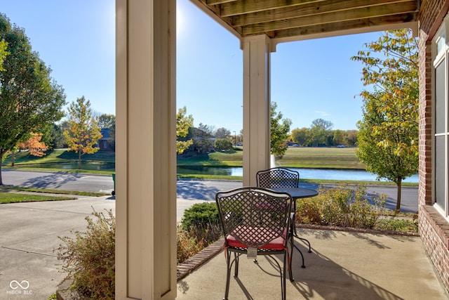 7189 Lockford N, Avon, IN 46123 - view of patio / terrace with a water view and a porch