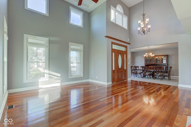 7189 Lockford N, Avon, IN 46123 - entrance foyer with a chandelier, a towering ceiling, hardwood / wood-style floors, and baseboards