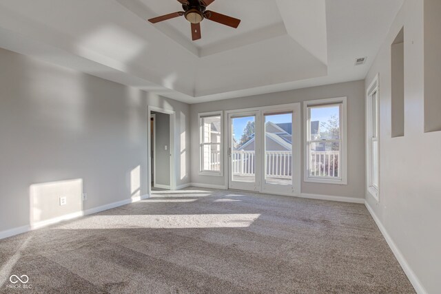 7189 Lockford N, Avon, IN 46123 - unfurnished room featuring a raised ceiling, carpet, baseboards, and ceiling fan
