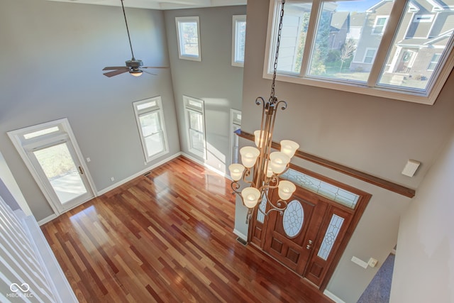 7189 Lockford N, Avon, IN 46123 - entryway with a towering ceiling, a chandelier, wood finished floors, baseboards, and a ceiling fan