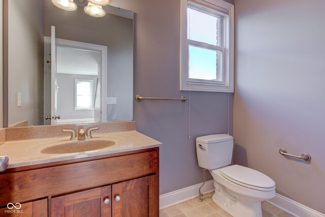 7189 Lockford N, Avon, IN 46123 - bathroom featuring baseboards, toilet, and vanity
