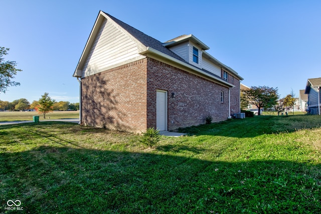 7189 Lockford N, Avon, IN 46123 - view of home's exterior with a yard, brick siding, and cooling unit
