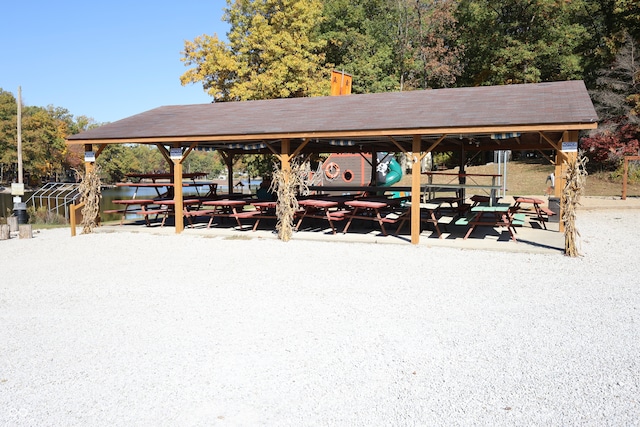 view of property's community featuring a water view and a gazebo