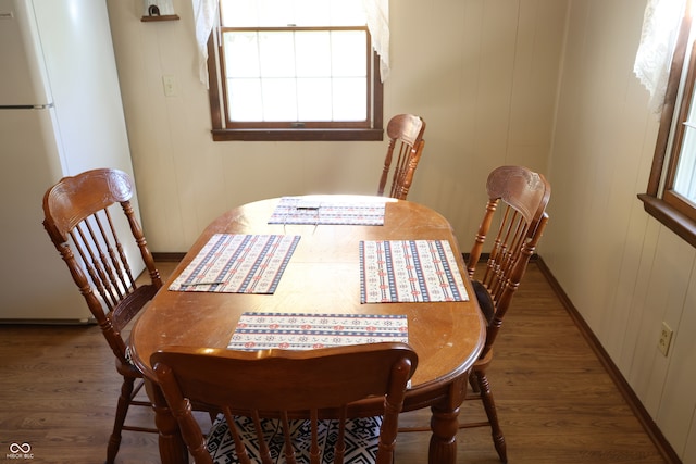 dining space with hardwood / wood-style floors and plenty of natural light