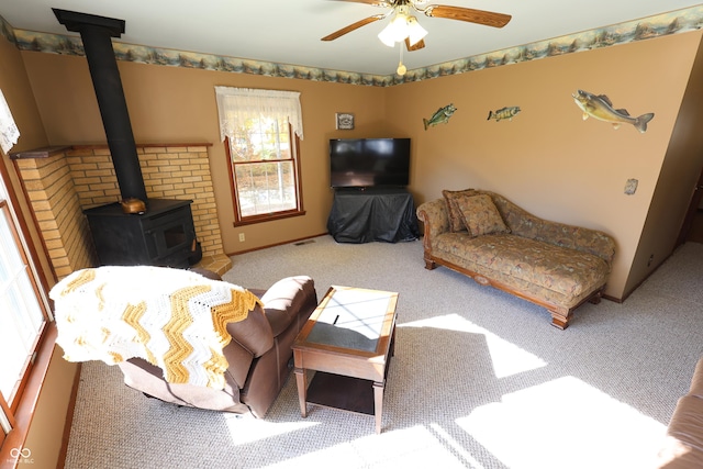 9540 E Brentmoore Rd, Brazil, IN 47834 - carpeted living area with a wood stove and a ceiling fan