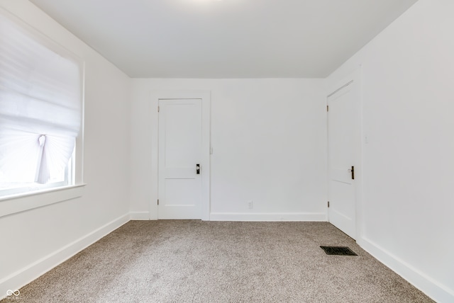 spare room with carpet floors