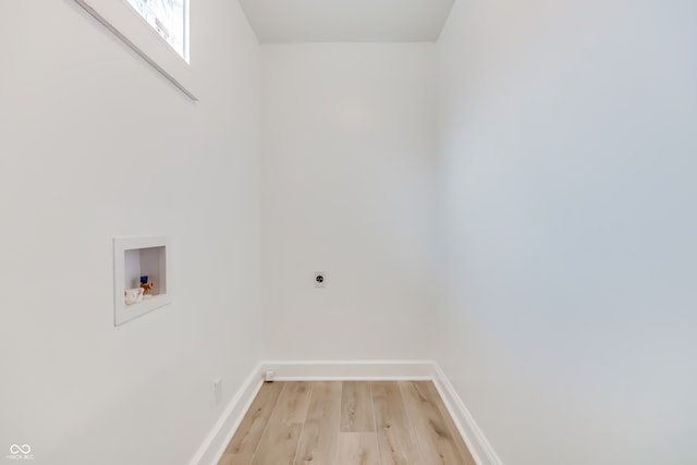 laundry room featuring hookup for a washing machine, electric dryer hookup, and light hardwood / wood-style floors