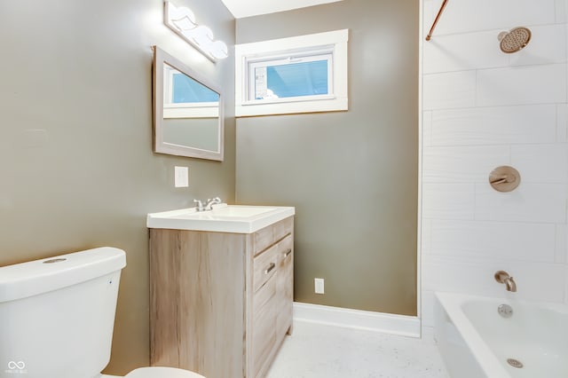 full bathroom featuring vanity, toilet, and tiled shower / bath combo