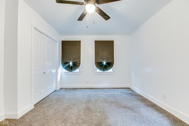 carpeted empty room with ceiling fan