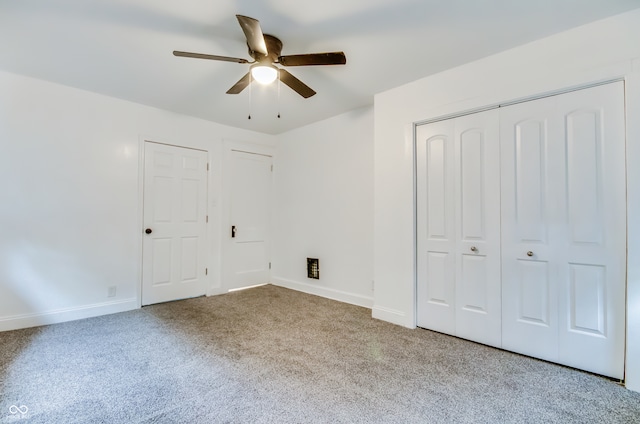 unfurnished bedroom featuring light carpet and ceiling fan