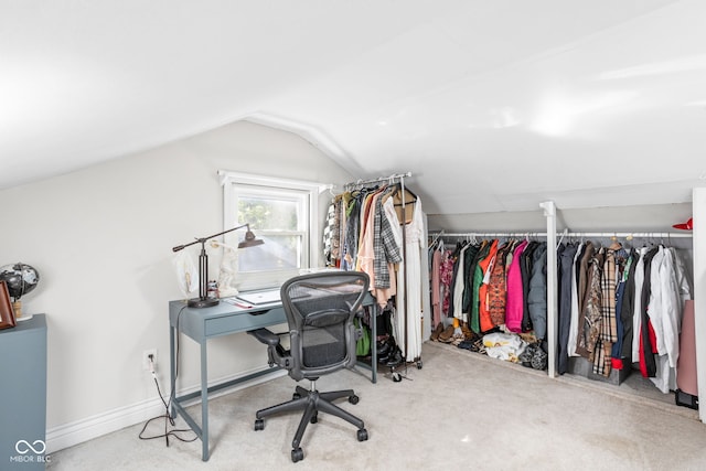 office featuring lofted ceiling and carpet flooring