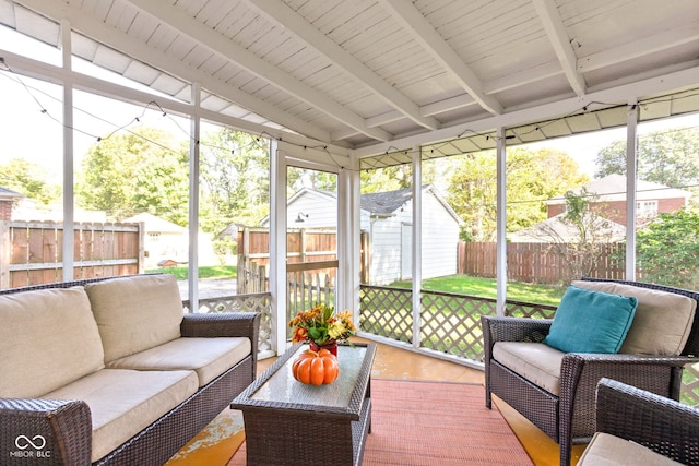 sunroom / solarium with wood ceiling and lofted ceiling with beams