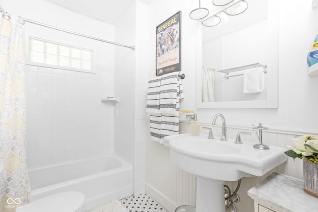 bathroom featuring toilet and shower / bathtub combination with curtain