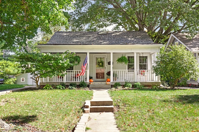 bungalow-style house featuring a porch and a front yard