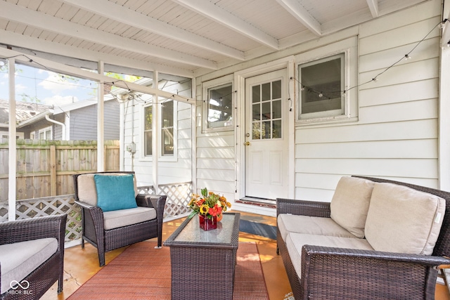 sunroom / solarium with beam ceiling and wood ceiling