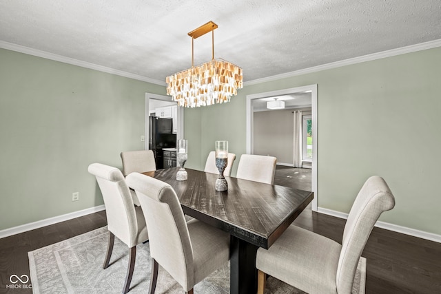 dining space with dark wood-type flooring, crown molding, a textured ceiling, and an inviting chandelier