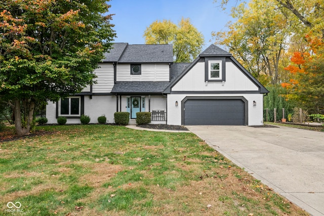 view of front of house with a front lawn and a garage