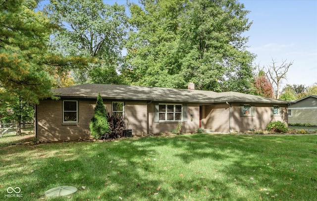 ranch-style house with a front lawn