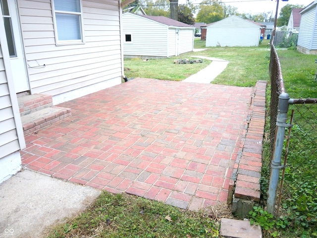 view of patio featuring a storage shed