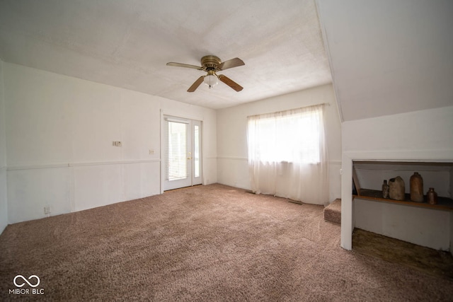 interior space featuring vaulted ceiling and ceiling fan