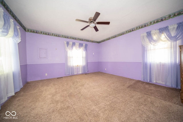 empty room with carpet floors and ceiling fan