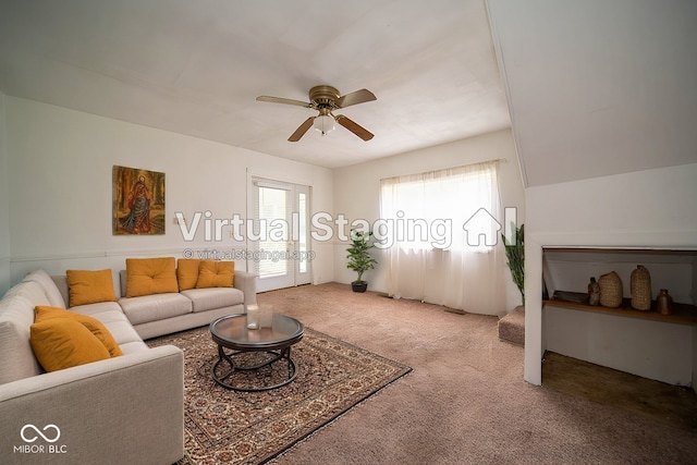 carpeted living room featuring ceiling fan