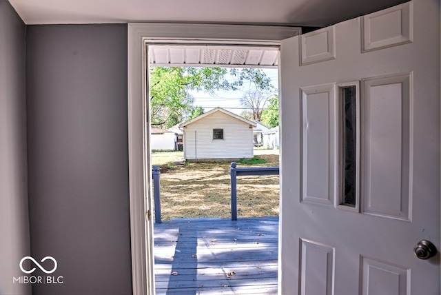 entryway with hardwood / wood-style floors