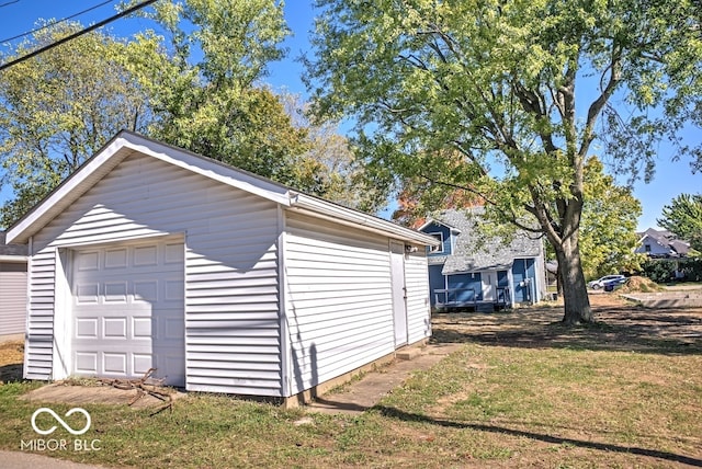 garage featuring a lawn