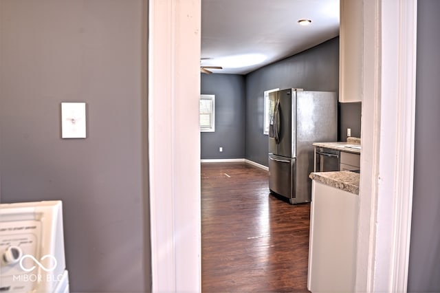 kitchen featuring appliances with stainless steel finishes, ceiling fan, and dark hardwood / wood-style flooring