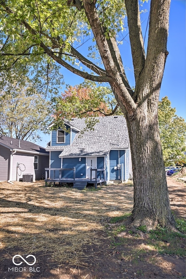 view of property with central AC and a wooden deck