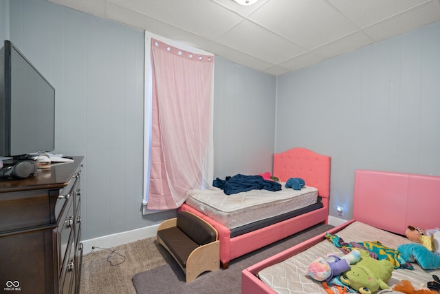 bedroom with carpet and a drop ceiling