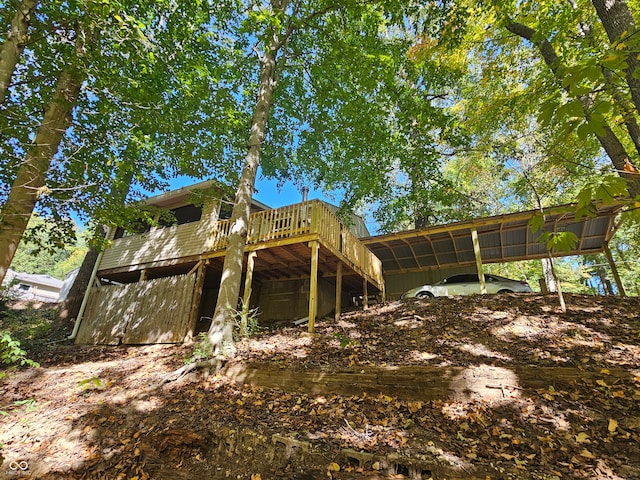 view of home's exterior with a wooden deck