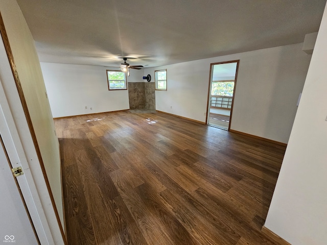 spare room with ceiling fan and wood-type flooring