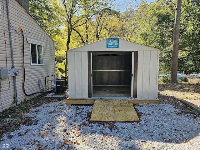 view of outbuilding featuring cooling unit