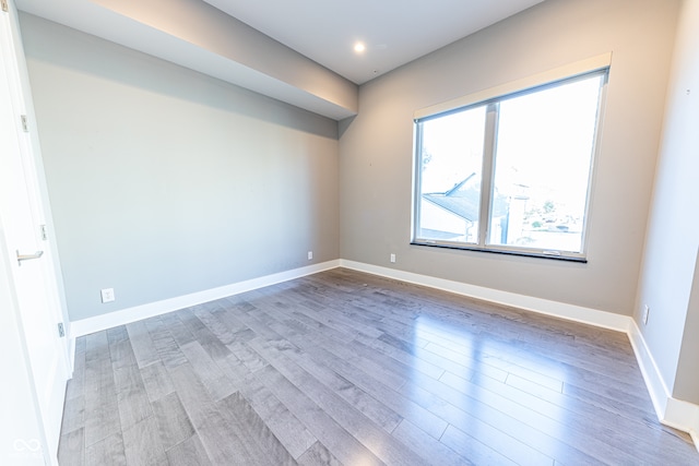 unfurnished room featuring hardwood / wood-style floors