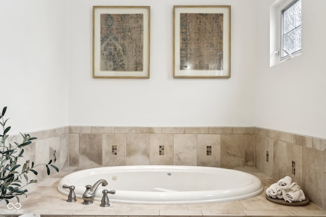 bathroom with tiled bath