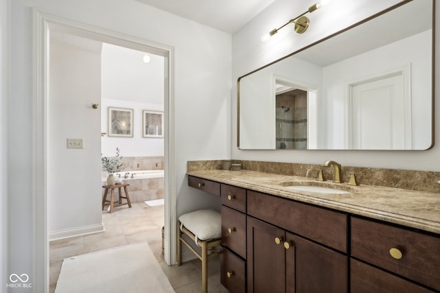 bathroom with vanity, tile patterned floors, and separate shower and tub